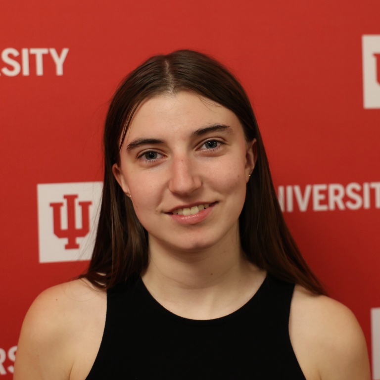 A portrait of a person smiling at the camera